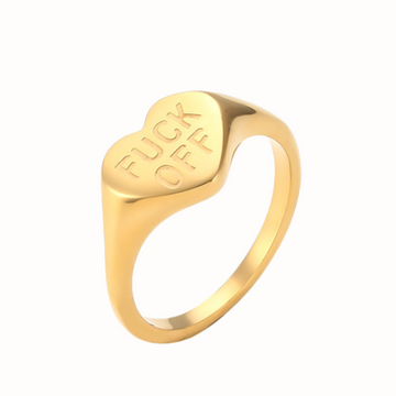 Stainless steel heart-shaped ring engraved with “F Off”.