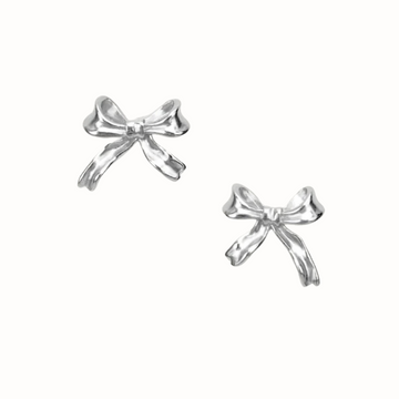 Close-up of dainty sterling silver bow stud earrings.