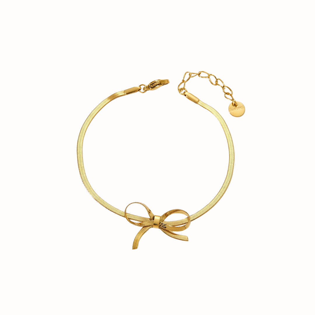 Delicate stainless steel ribbon-style bracelet with flowing snake chains.