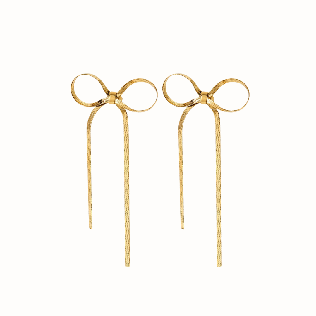 Gold bow stud earrings with long dangling chains.
