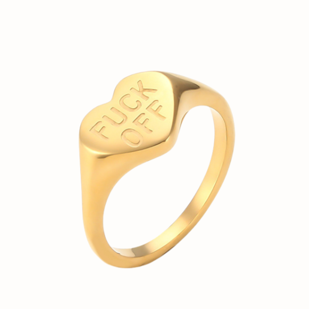Stainless steel heart-shaped ring engraved with “F Off”.