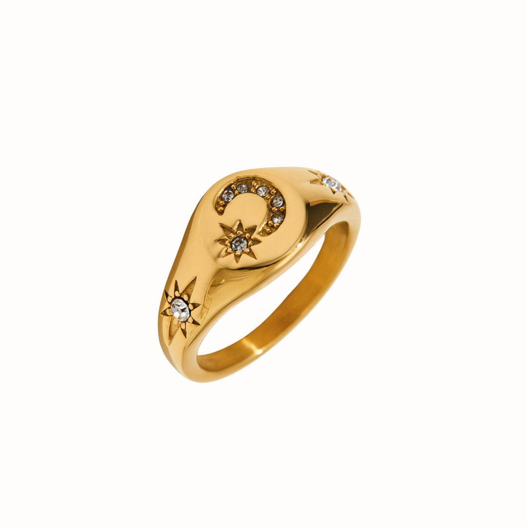 A celestial stainless steel signet ring with moon and star cubic zirconia.