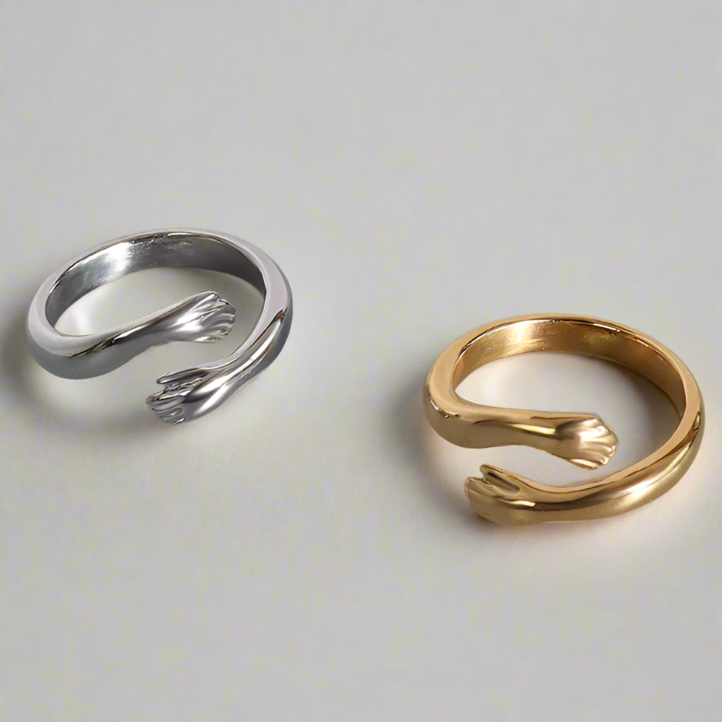 Silver and gold rings on a white background