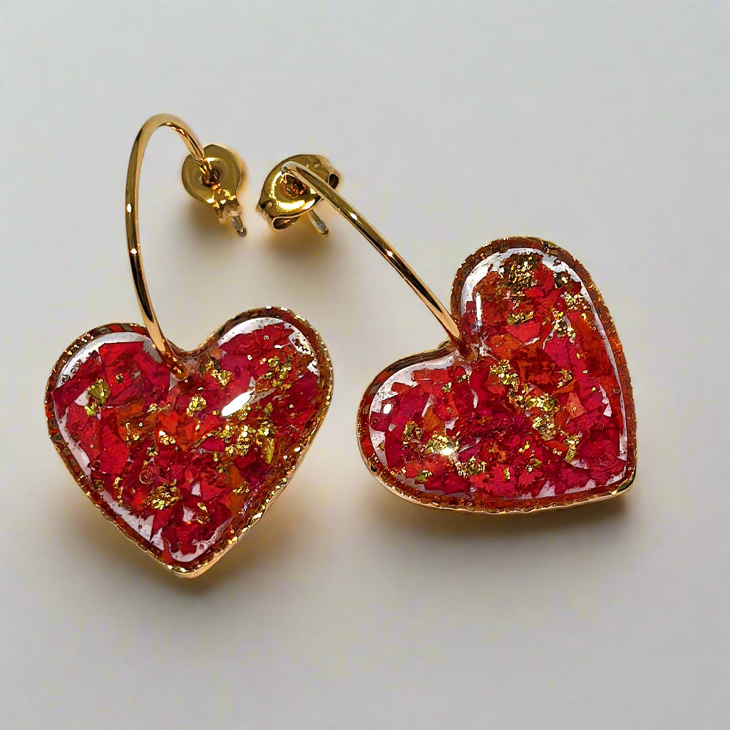 Heart-shaped resin earrings with real rose petals inside.