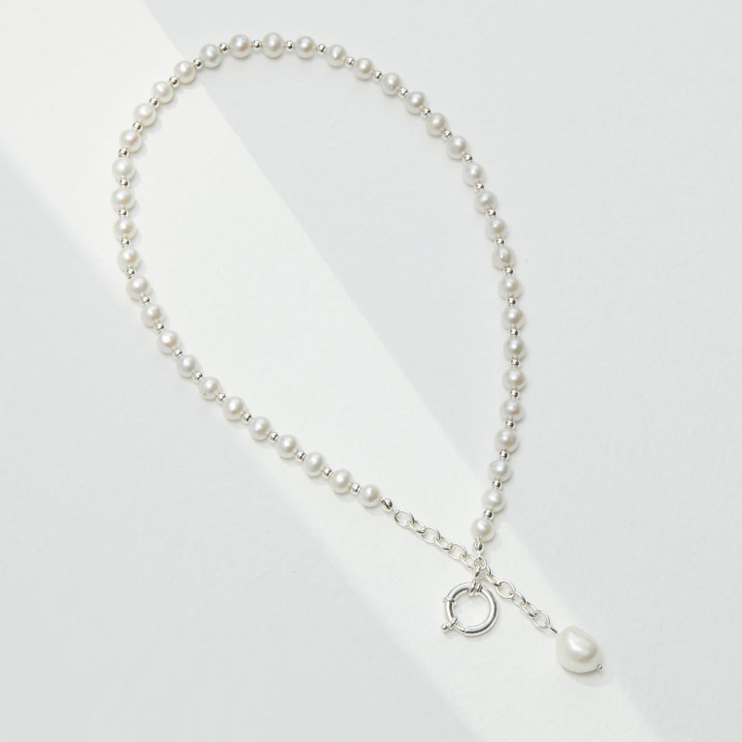 Sterling silver pearl toggle choker necklace with baroque pearl dangle.